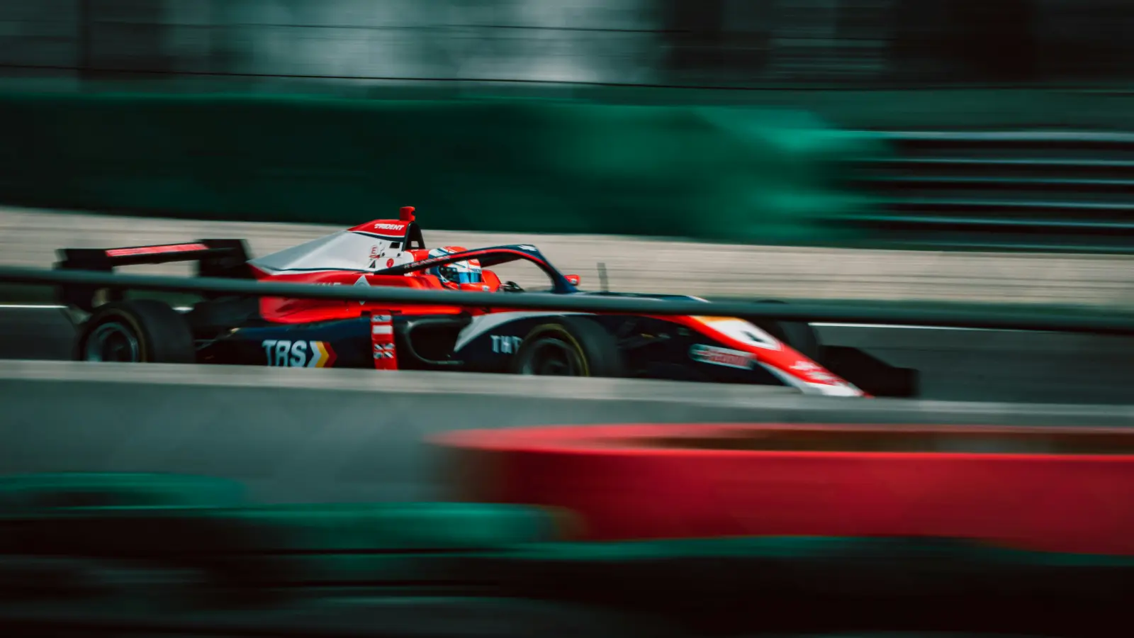 Race car in motion representing atomic settlement speed