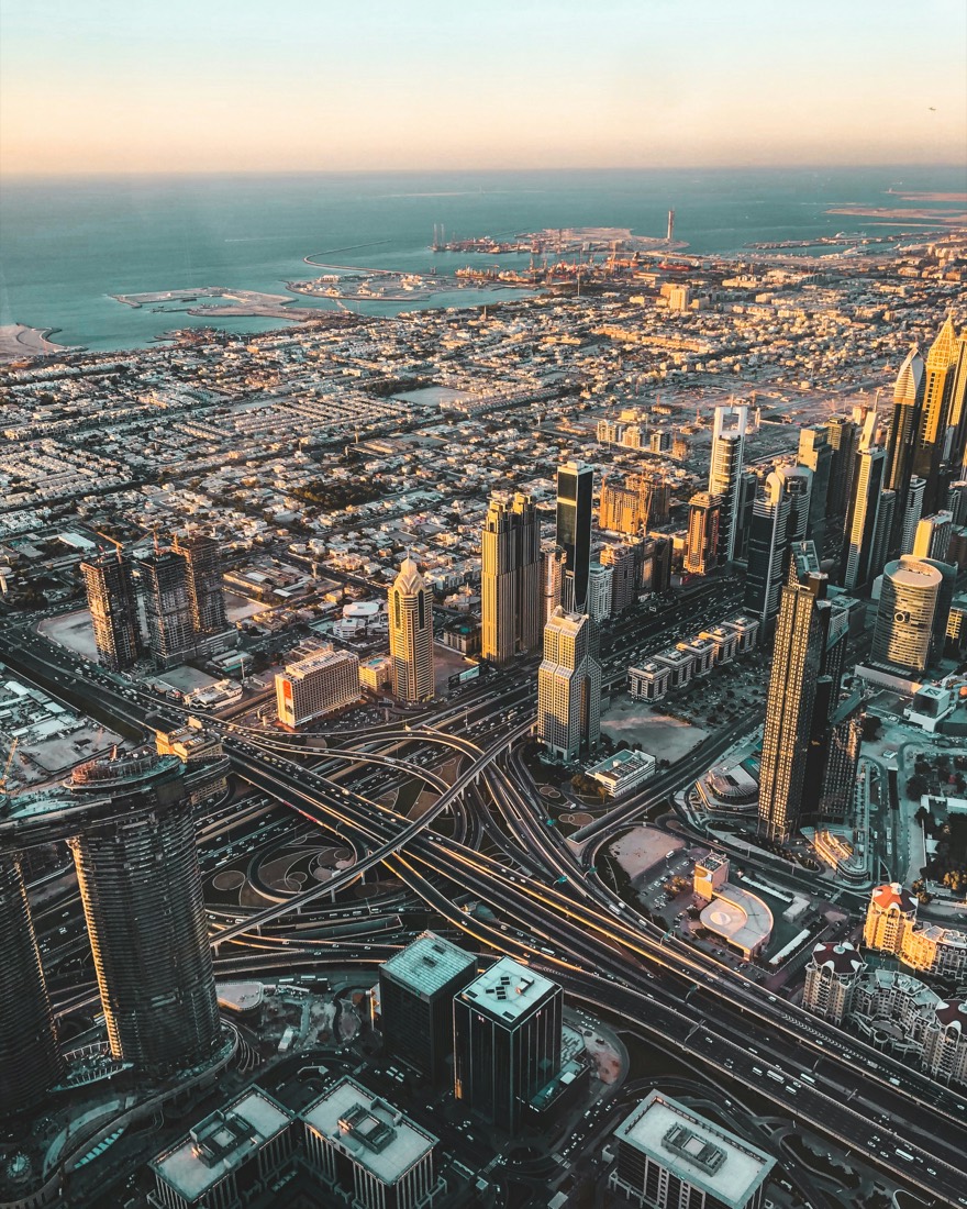 Aerial view of a city skyline at sunset