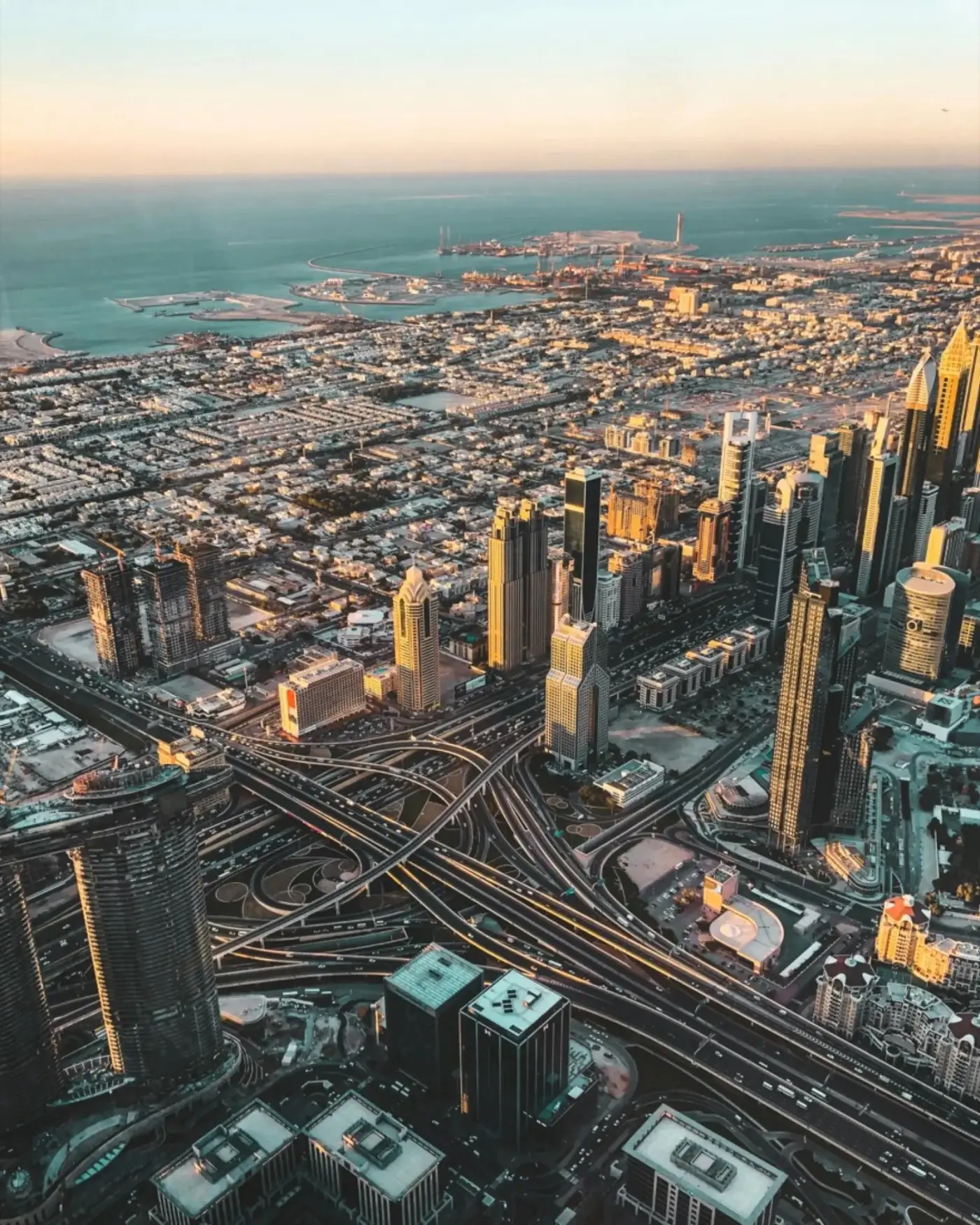 Aerial view of a city skyline at sunset