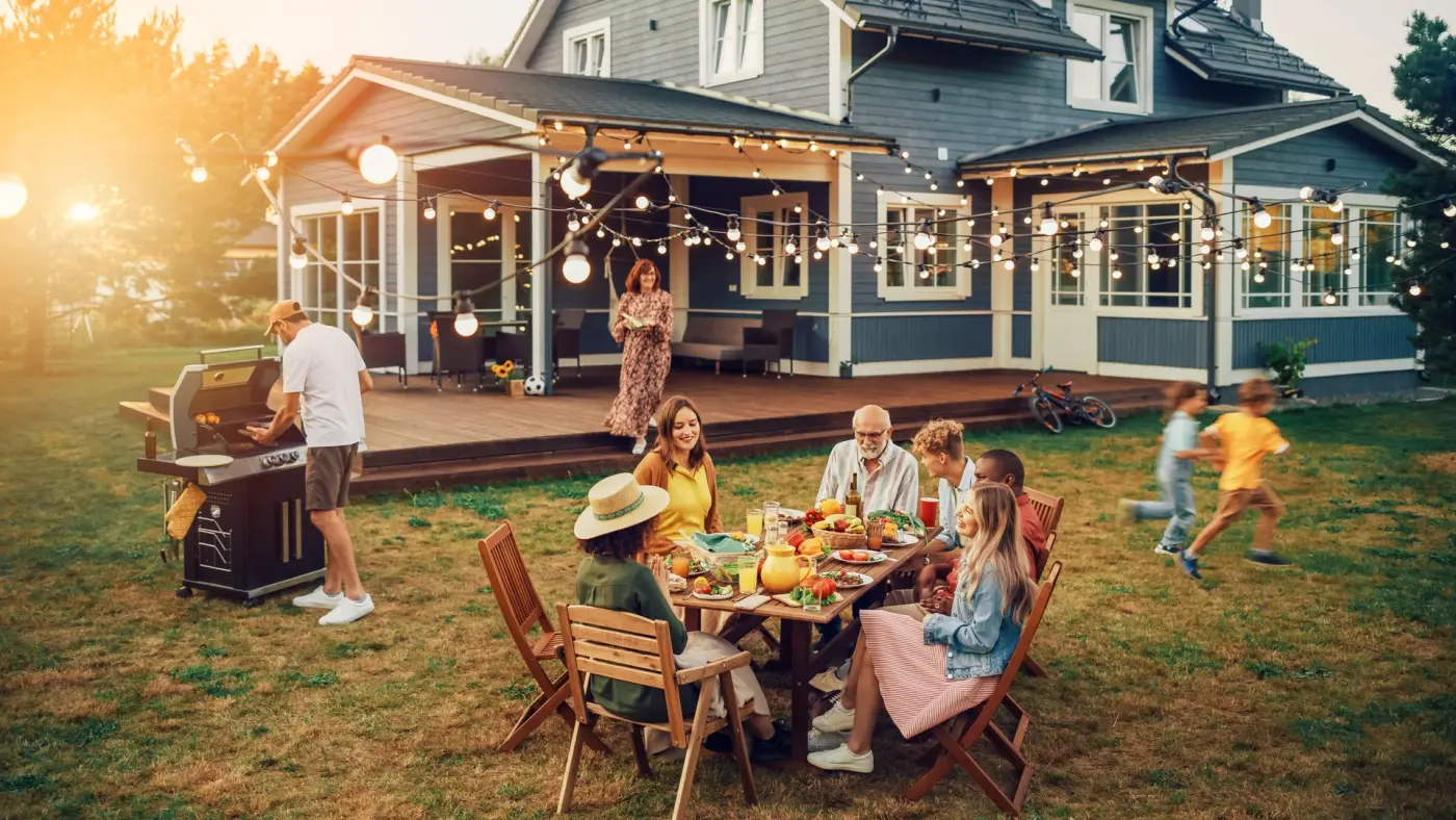 Family gathering at a house at dusk